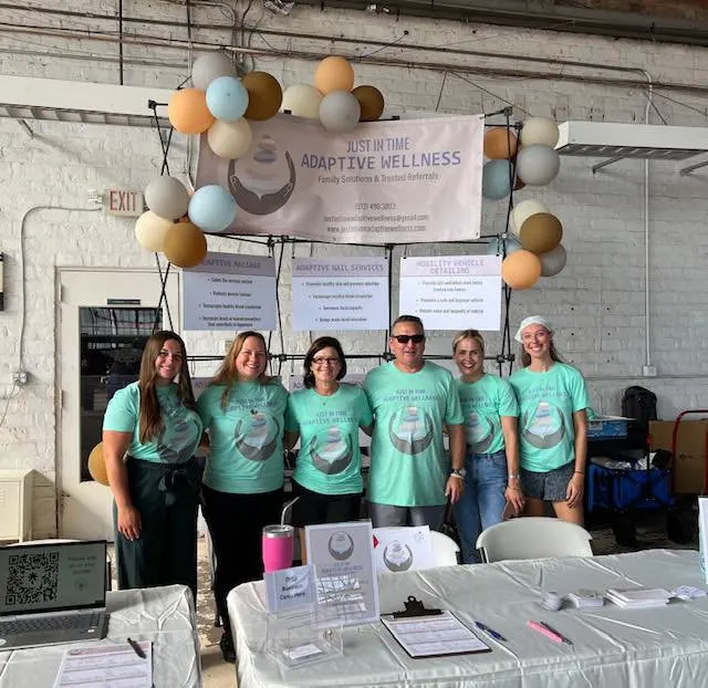 Just In Time Adaptive Wellness team at a community resource table