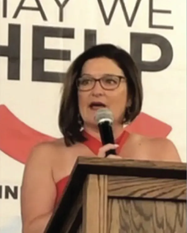 Dana Spradling speaking at a podium